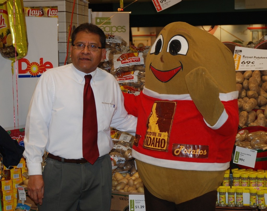 Spuddy Buddy, with a Hen House representative, greeted shoppers during the store's Potato Lover's Month promotions.
